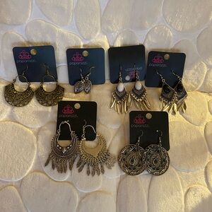 New Paparazzi dangle earrings. Never warn and in good condition. 14 pieces total